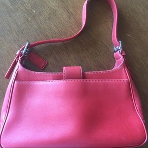 Red small vintage Coach purse.